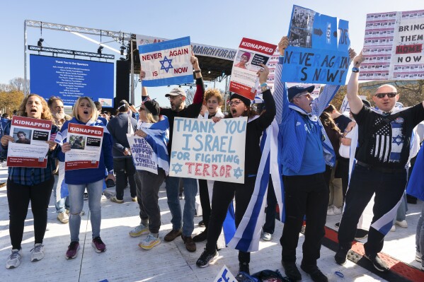 Participants hold signs as they stand on the Natio<em></em>nal Mall at the March for Israel on Tuesday, Nov. 14, 2023, in Washington. (AP Photo/Manuel Balce Ceneta)