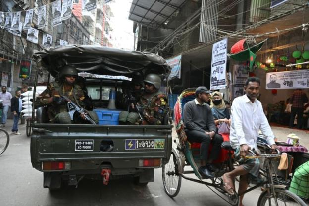 Soldiers patrol a neighbourhood in Dhaka, Bangladesh, a day ahead of the country's natio<em></em>nal election.