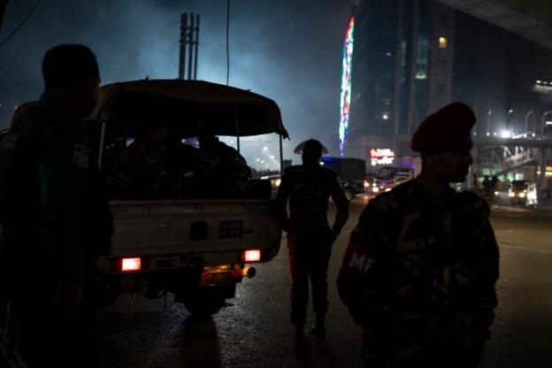 Soldiers stand guard in Dhaka, Bangladesh on Saturday, on the eve of the country's natio<em></em>nal election.