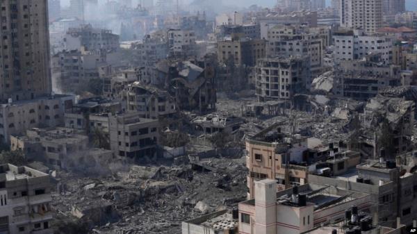 FILE - Destruction from Israeli aerial bombardment is seen in Gaza City, on Oct. 11, 2023.