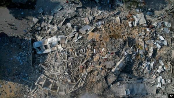 FILE - A view of the rubble of a building after it was struck by an Israeli airstrike, in Gaza City, on Oct. 8, 2023.