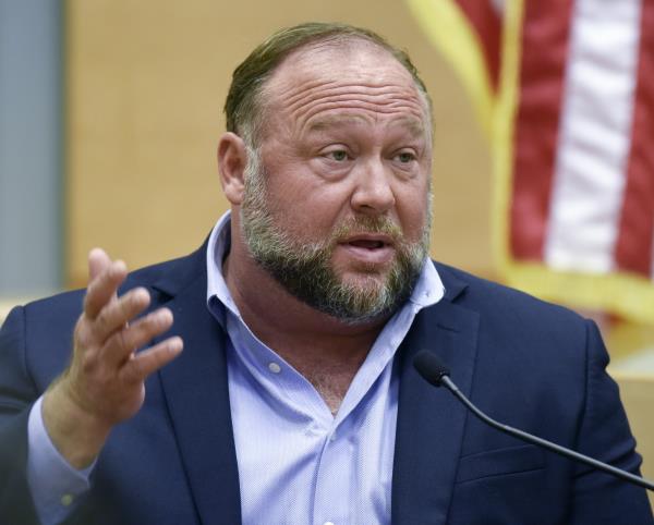 FILE - Co<em></em>nspiracy theorist Alex Jo<em></em>nes takes the witness stand to testify at the Sandy Hook defamation damages trial at Co<em></em>nnecticut Superior Court in Waterbury, Conn. Thursday, Sept. 22, 2022. A Texas judge has ruled that Jo<em></em>nes cannot use bankruptcy protection to avoid paying nearly $1 billion to families who sued over his co<em></em>nspiracy theories that the Sandy Hook school massacre was a hoax. (Tyler Sizemore/Hearst Co<em></em>nnecticut Media via AP, Pool, File)