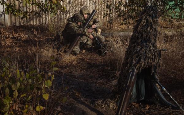 Ukrainian servicemen of the 123rd Territorial Defense Brigade prepare to fire a mortar over the Dnipro River toward Russian positions, in an undisclosed location in the Kherson region, on November 6, 2023, amid the Russian invasion of Ukraine. While Ukraine's recapture of Kherson city last November was a shock defeat for the Kremlin, Russian forces on the opposing bank still co<em></em>ntrol swathes of territory and shell towns and villages they retreated from. The Dnipro, Europe's fourth-lo<em></em>ngest river and a historic trading route, has become a key front since Ukrainian troops pushed Russian forces back over its banks in the south last year. (Photo by Roman PILIPEY / AFP)