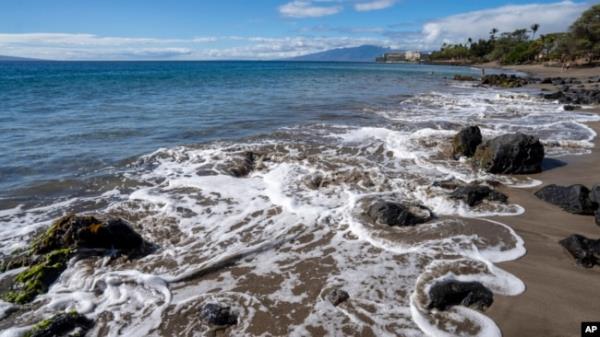 FILE - The tide circulates around rocks as it rises at Wahikuli Wayside Park on Nov. 3, 2023, in Lahaina, Hawaii.