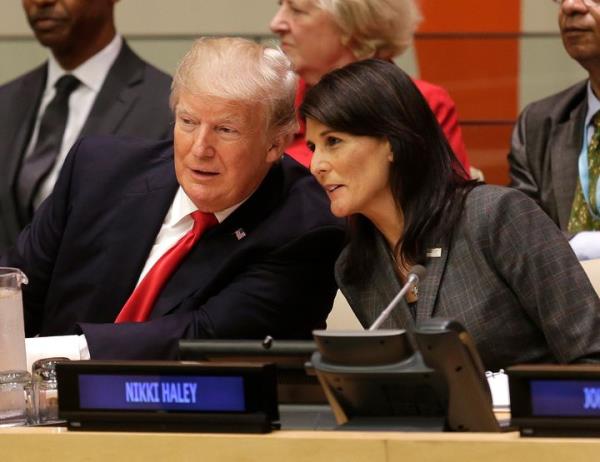 Then-President Do<em></em>nald Trump speaks with Nikki Haley, who was U.S. ambassador to the United Nations, at U.N. headquarters on Sept. 18, 2017.