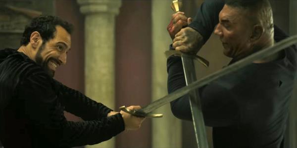 Angus Mackenzie (Scott Adkins) and Joe Flood (Dave Bautista) in a sword fight in The Killer's Game (2024)