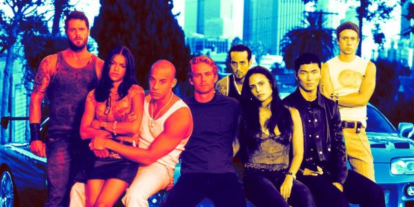 The cast of The Fast and the Furious pose in front of cars