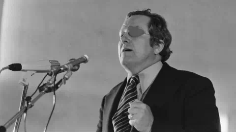 Getty Images Front Natio<em></em>nal candidate for the 1974 French presidential election Jean-Marie Le Pen, wearing an eye patch, delivers a speech during an electoral rally on April 26, 1974 in Colmar