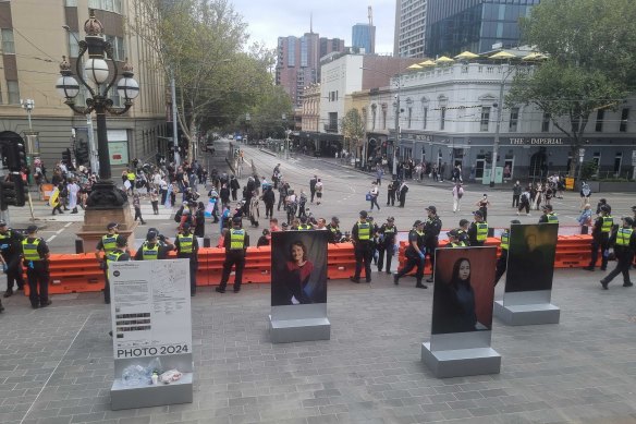 #WomenWillSpeak protesters spoke on the steps of Parliament House on Saturday, as a strong police presence separated them from trans rights protesters.
