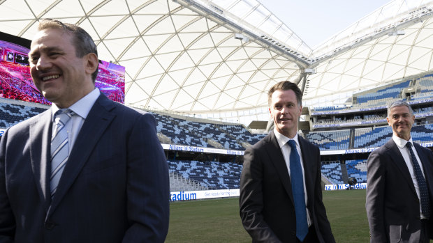 NSW Premier Chris Minns with ministers Steve Kamper, left, and John Graham, right, at Allianz Stadium
