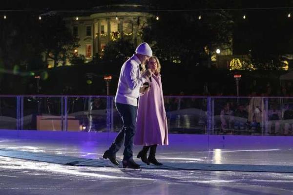 1988 Olympic figure skater Brian Boitano, left, skates next to first lady Jill Biden during the unveiling of the White House Holiday Ice Rink, located at the south panel of the South Lawn of the White House, Wednesday, Nov. 29, 2023, in Washington. (AP Photo/Jacquelyn Martin)